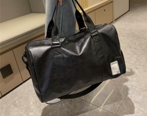 旅行包男款大容量斜挎手提皮质防水行李包女高...