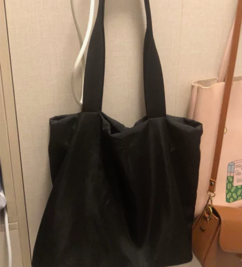 nome黑色防水帆布包单肩 非常好背 简约...