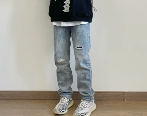 自主自产高街浅蓝色磨破墨点修身显瘦水洗牛仔...