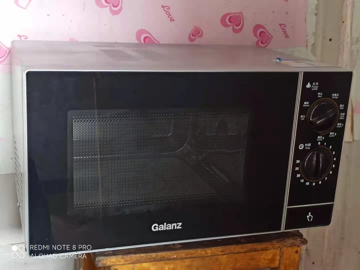 低价转让一台格兰仕微波炉,九成新内外干净无...