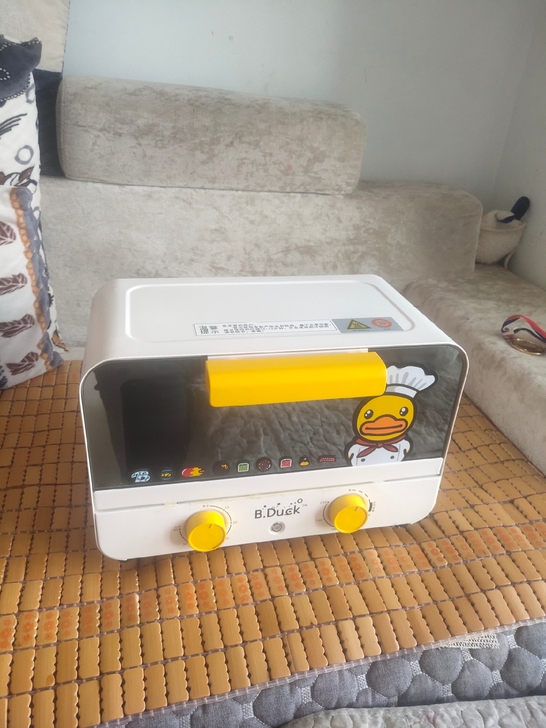 新款小黄鸭多功能烤箱9成新，家里还有一个大...