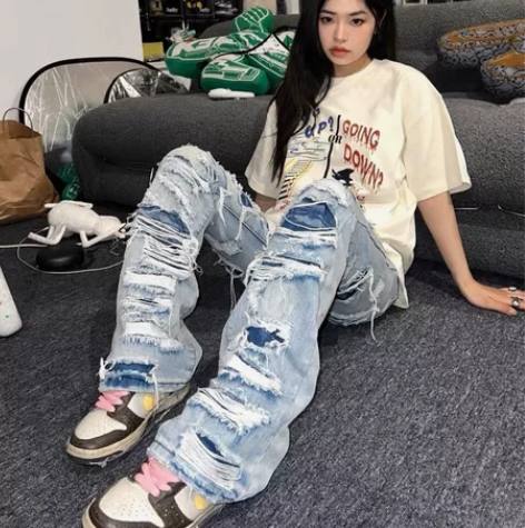 美式复古水洗破洞微喇叭牛仔裤男女宽松vin...