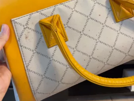 无限极的,妈妈收拾出来的。黄色手提包,包包...