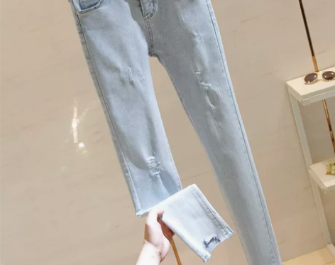 浅蓝色破洞紧身牛仔裤子女2020高腰抓纹小...