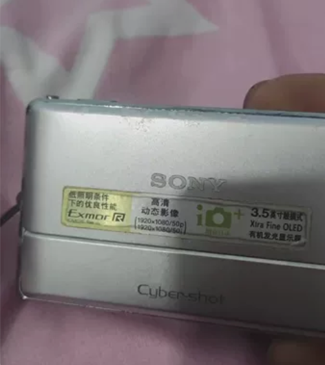 索尼相机TX-100拍照正常，表面有点磨损...