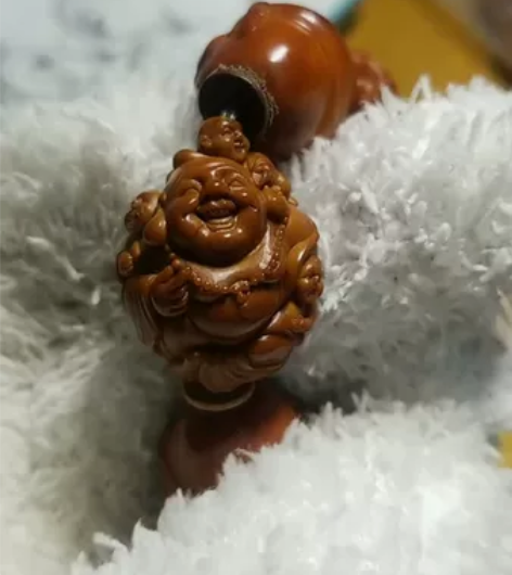 橄榄核单籽多宝手串,分别是皙俨老师浮雕童子...