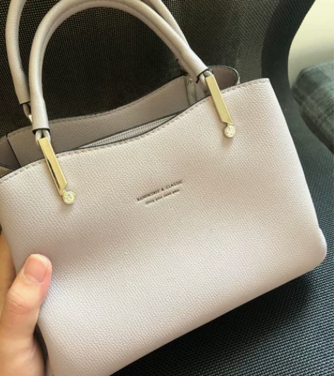 袋鼠品牌简约手提女包 材质：PU 品牌：袋...