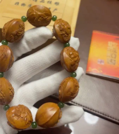 自玩2.45双面风景观音橄榄核手串。整串9...