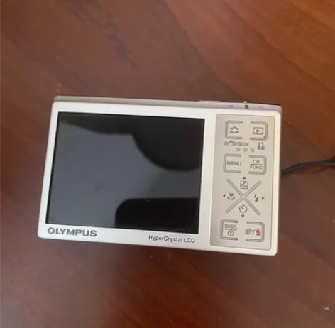 奥林巴斯u1040 成色如图 拍照有微暗角...
